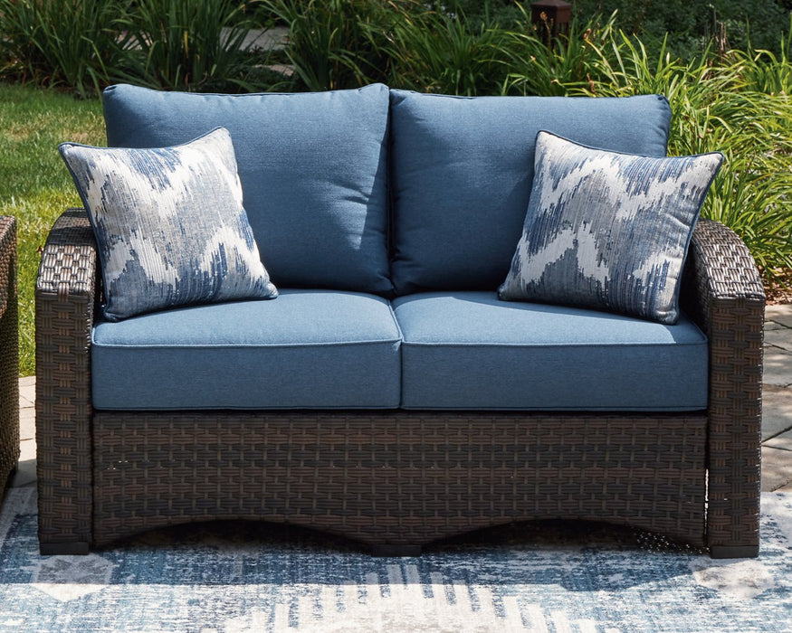 Windglow Outdoor Loveseat with Cushion - Home And Beyond