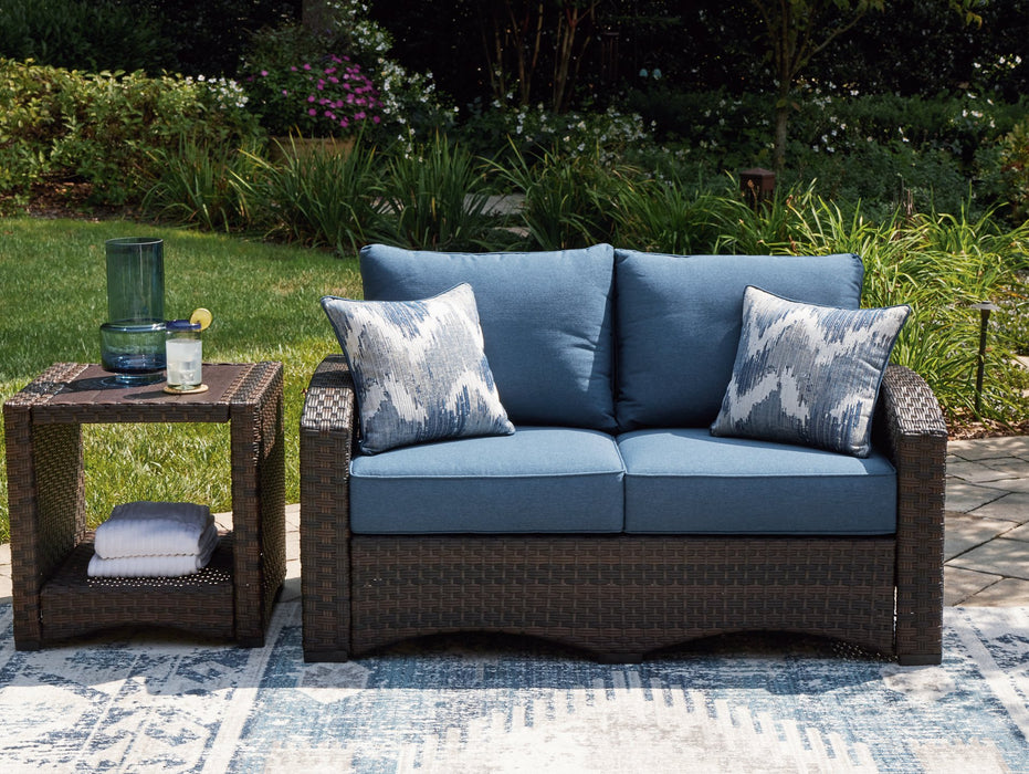 Windglow Outdoor Loveseat with Cushion - Home And Beyond