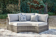 Harbor Court Curved Loveseat with Cushion - Home And Beyond